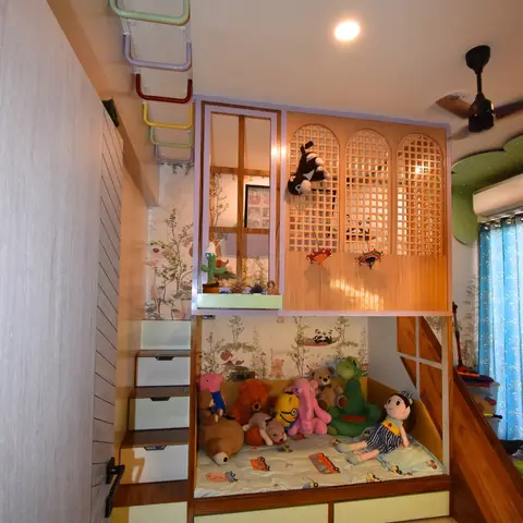 Kids' bedroom with an elaborate loft playhouse bed featuring a lattice jaali panel, built-in slide, monkey-bar ladder, and panda-print wallpaper.