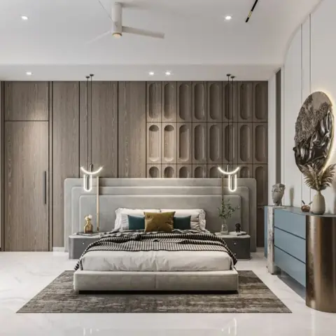 King bed against a fluted wood panelling wall with carved oval niches, flanked by ring-shaped pendant lights and a sculptural bronze wall piece beside a blue