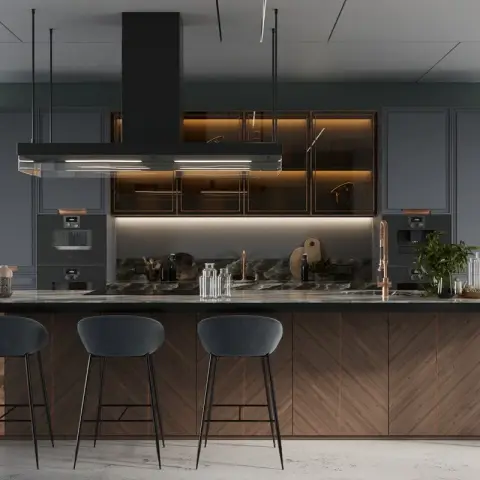 Kitchen island with a herringbone wood and weathered-copper base, dark stone countertop, green marble backsplash