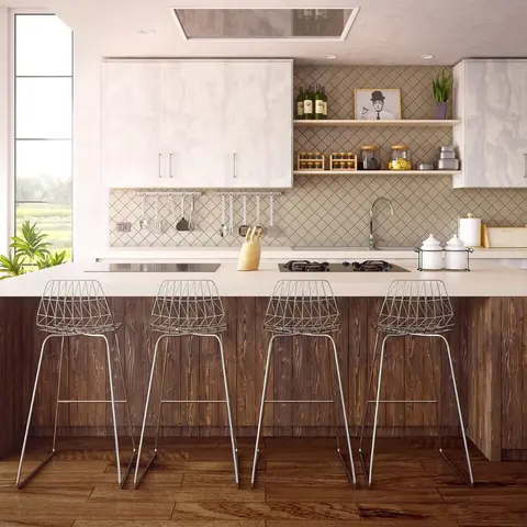 Kitchen island with a rustic reclaimed-wood-panelled base, white stone countertop seating four wire-frame bar stools, diamond-pattern tile backsplash