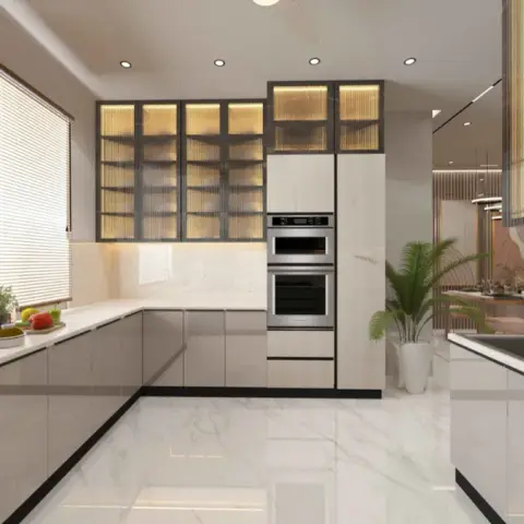L-shaped greige handleless kitchen under a wooden venetian blind, with a stacked built-in microwave and oven tower and backlit reeded-glass wall cabinets in