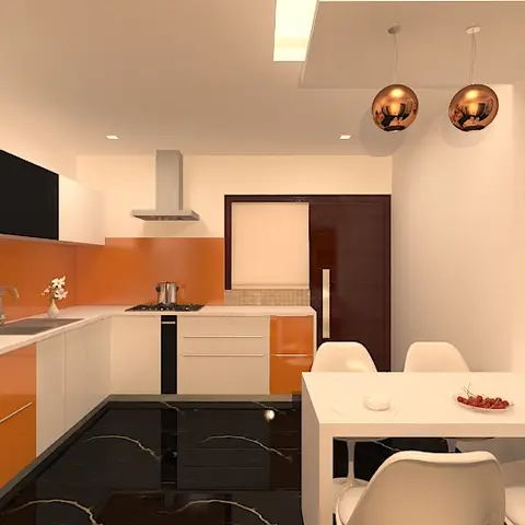 L-shaped modular kitchen with glossy orange shutters and a matching backsplash, opening onto a compact dining nook lit by two copper globe pendants over a