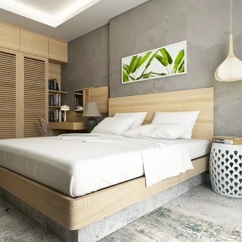 Light-wood bedroom with louvered wardrobe doors, a woven bed headboard, and a globe pendant light beside a ceramic garden-stool nightstand.