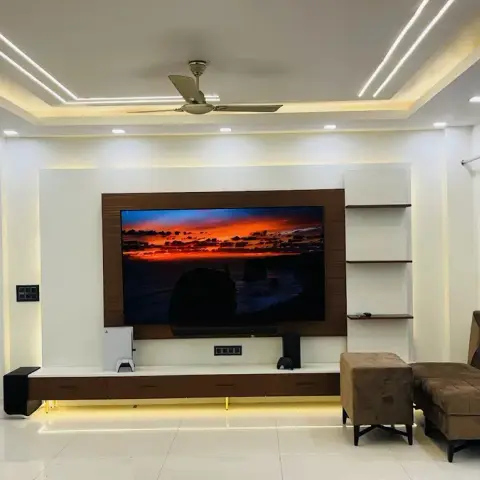 Living room built around a white-and-walnut wall-hung TV unit on an LED underglow