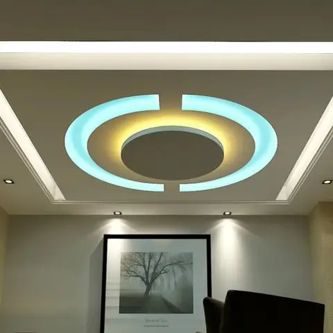 Living-room ceiling detail with a concentric-ring POP design backlit in cool cyan and warm-yellow LED