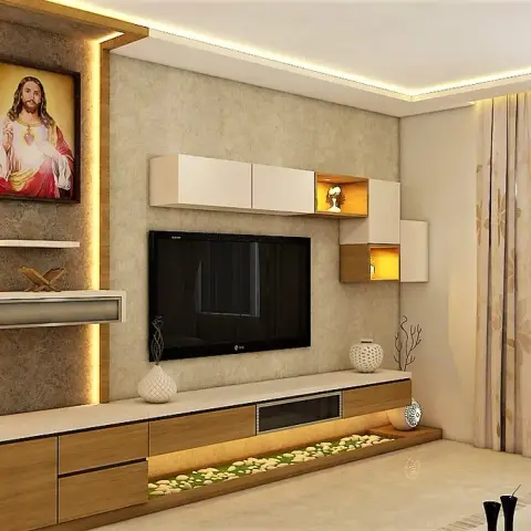 Living-room render where the TV sits on a textured stone-clad wall next to a backlit prayer niche holding a framed Sacred Heart picture