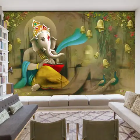 Living room shown with a full-wall Ganesha mural wallpaper — the deity reading beneath hanging brass bells with peacocks below — behind a long white banquette