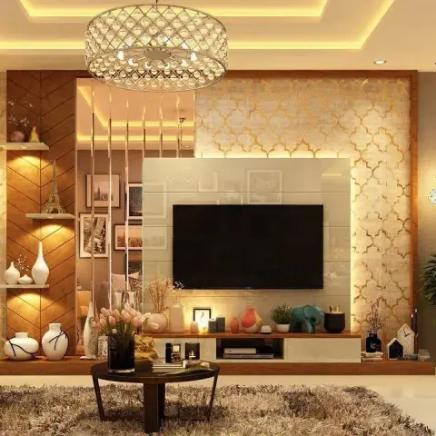 Living room TV feature wall in gold quatrefoil-patterned wallpaper with a crystal drum chandelier, chevron-panelled display shelving