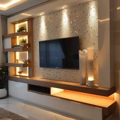 Living room TV feature wall with sparkly textured wall cladding under a cove-lit ceiling drop