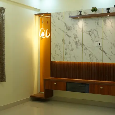 Living room TV feature wall with marble-effect panelling over a fluted wood-veneer base, a floating TV console