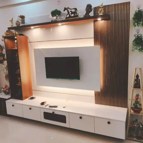 Living room TV unit with a fluted wood-slat accent panel, backlit display shelf and curated curio figurines