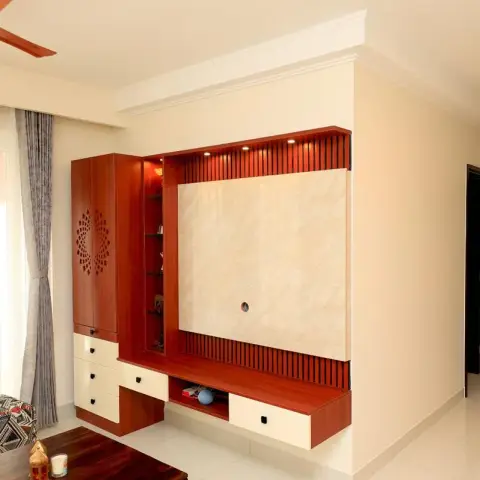 Living-room TV wall in cherry-red veneer with a fluted batten surround, a beige marble slab back panel and cream drawer fronts