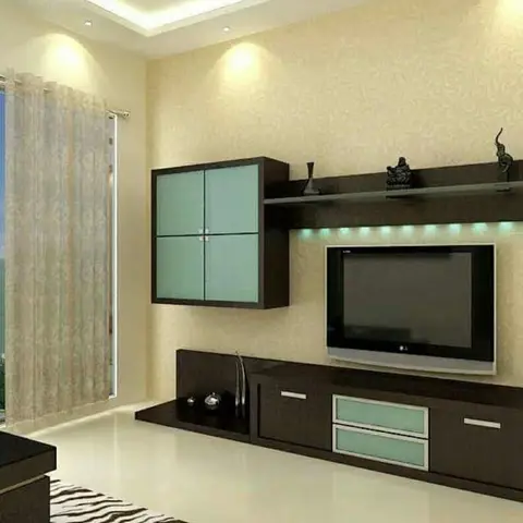 Living room TV wall with a wenge-finish wall unit featuring mint frosted-glass cabinet doors and a floating display shelf with LED under-lighting