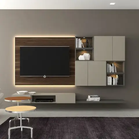 Living room TV wall with a backlit walnut panel behind the television, flanking taupe modular cabinets with open display niches, a white sofa