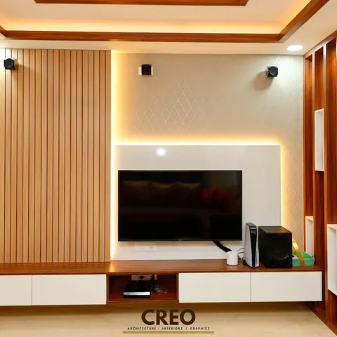 Living room TV wall with a fluted wood slat panel beside a backlit diamond-textured accent wall, a floating two-tone TV console