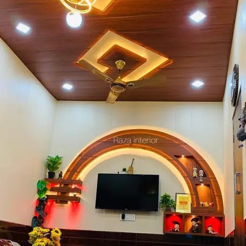 Living room TV wall with an arched, backlit wood-veneer display niche housing curios and a matching wood-plank false ceiling with a diamond cove light and gold