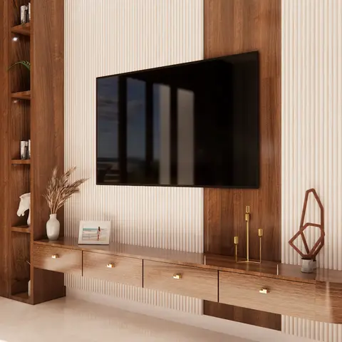 Living room TV wall with mixed walnut-veneer and fluted cream panelling, a curved floating TV console with brass drawer pulls
