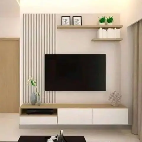 Living room TV wall with vertical fluted panelling beside a floating white-and-wood console and an open display shelf