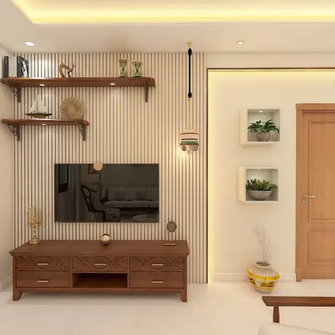 Living room TV wall with vertical fluted wood slat panelling, a carved wood TV console with brass drawer pulls