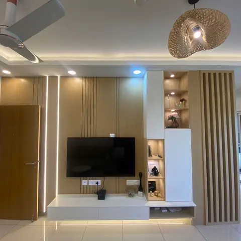 Living room TV wall with vertical oak panelling, a floating white-and-wood display unit with lit niches, a fluted wood room-divider screen