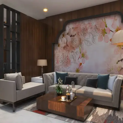 Living room where a blush cherry-blossom mural is framed by a dark cusped arch against walnut veneer walls, with a tufted grey velvet sofa