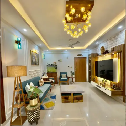 Living room where a brass sputnik cluster of amber glass bulbs drops from a teak ceiling box, over a teal-cushioned teak sofa