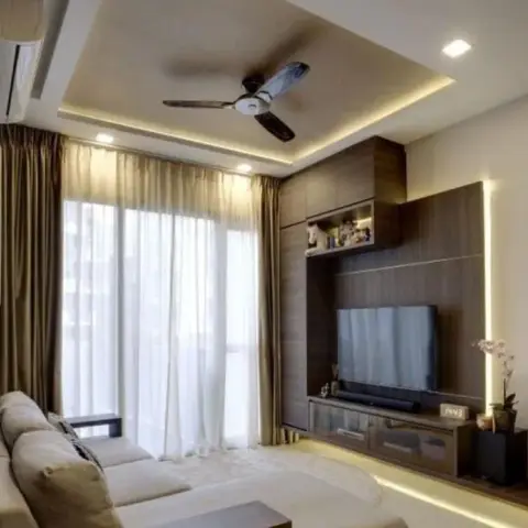 Living room where a dark veneer TV wall with a lit glass display box and a glass-fronted drawer console is edged by a vertical LED strip