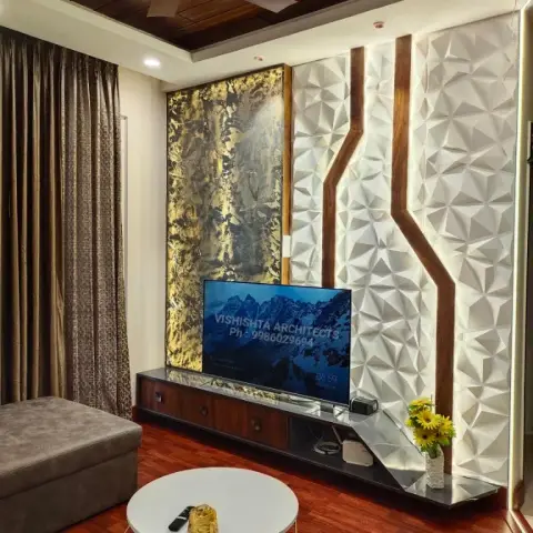Living room with a 3D geometric wood-inlay wall panel beside a gold textured art panel, a dark wood TV console, and a wood-slat ceiling with a bronze fan.