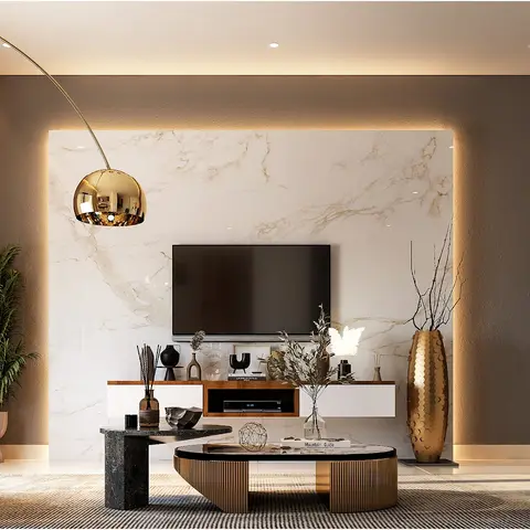 Living room with a backlit marble TV feature wall, gold arc floor lamp, teal velvet armchairs and a pair of round black-and-gold coffee tables.