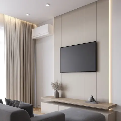 Living room with a beige fluted TV feature wall lit by a vertical LED strip, a floating wood-top console, and a dark grey sectional sofa.