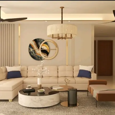 Living room with a beige L-shaped sofa in navy-accented cushions, a round marble coffee table