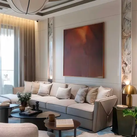 Living room with a beige sectional sofa beneath a large abstract painting flanked by bookmatched marble wall panels