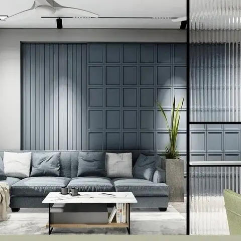 Living room with a blue-grey panelled feature wall combining vertical slats and a square-grid moulding, a grey sectional sofa