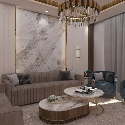 Living room with a book-matched marble feature wall trimmed in gold, a crystal drum chandelier, and channel-tufted taupe sofas facing navy velvet armchairs.