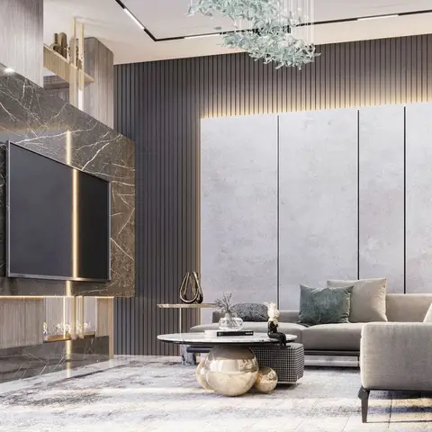 Living room with a book-matched marble slab TV wall housing a linear fireplace, fluted dark panelling, a leaf-branch chandelier
