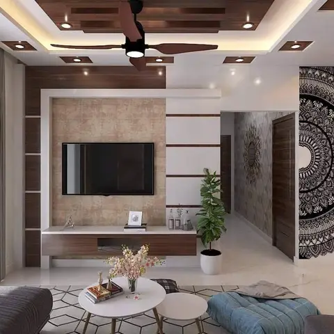 Living room with a boxed cove-lit POP false ceiling, a walnut-framed stone-clad TV feature wall with floating console