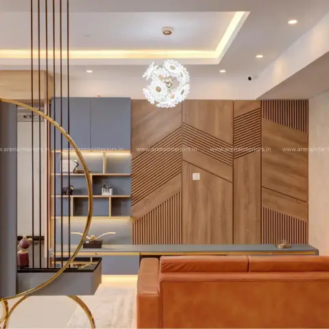 Living room with a chevron-patterned fluted wood panelling wall, a floral pendant chandelier, a curated console vignette