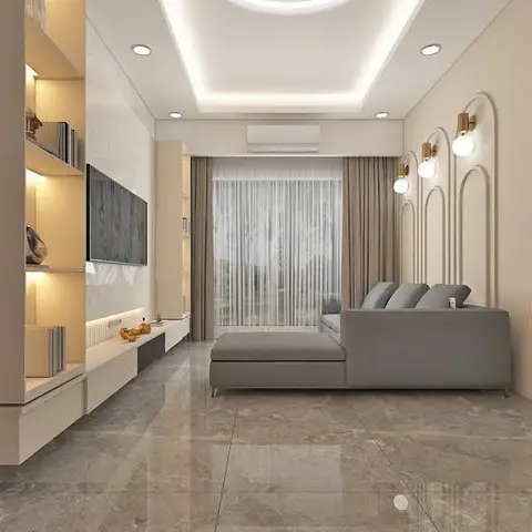 Living room with a circular cove-lit ceiling ring, backlit shelving beside the TV wall, an L-shaped grey sofa