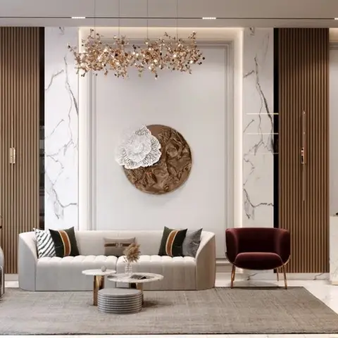 Living room with a cream channel-tufted sofa and a burgundy velvet accent chair on gold legs