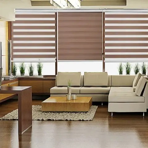 Living room with a cream sectional sofa and a low wood coffee table on a jute rug