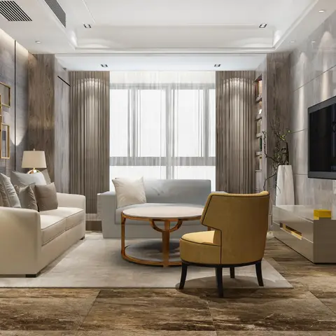 Living room with a cream sofa, mustard accent chair, and blue-grey loveseat around a round marble coffee table, beneath a cluster of gold-framed mirrors.