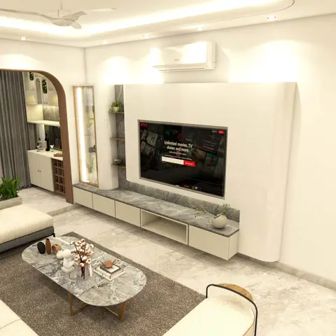 Living room with a curved glossy white TV feature wall on a grey marble-topped console, an arched bar nook, and an oval marble coffee table on a charcoal rug.