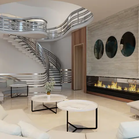 Living room with a curved white sectional sofa facing a linear built-in fireplace, three round mirrors on a stone-clad wall