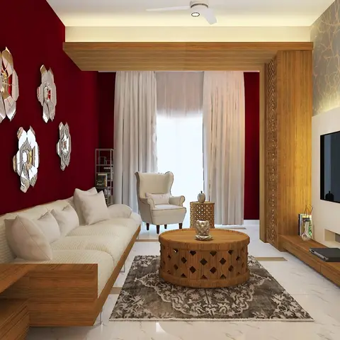 Living room with a deep maroon accent wall dressed with mirrored floral wall decor and a carved wood jaali side screen