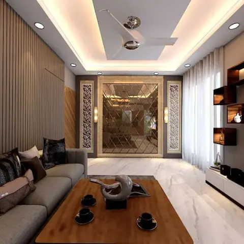 Living room with a diamond-mirror feature wall flanked by carved jaali panels and a wood slat side wall, cove-lit false ceiling, grey sofa