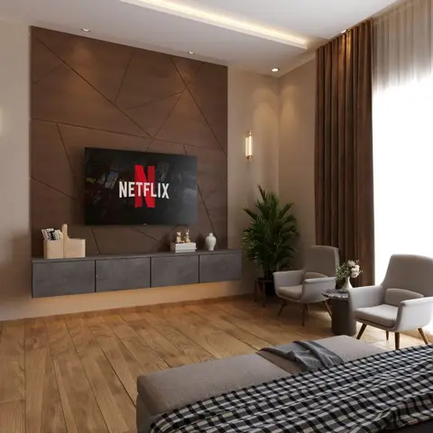 Living room with a faceted wood-panel TV feature wall, a floating grey stone console, a pair of grey armchairs, and warm wood flooring.