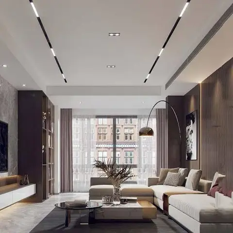 Living room with a fluted dark-wood accent wall, a floating TV console with open shelving, linear ceiling light tracks