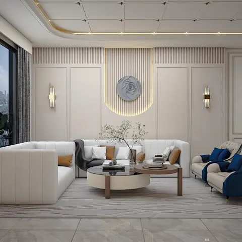 Living room with a fluted-panelled feature wall, circular sculptural wall art and navy-blue tufted armchairs beside a curved cream sofa