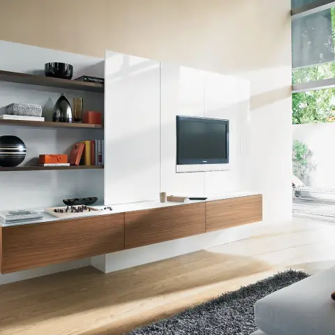 Living room with a fully wall-hung TV composition of white gloss panels, walnut floating drawers and three walnut shelves styled with a chess set and books