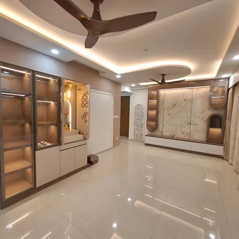 Living room with a glass-front backlit display unit housing a small pooja niche on one side and a marble-clad TV wall with jaali-cut display alcoves on the